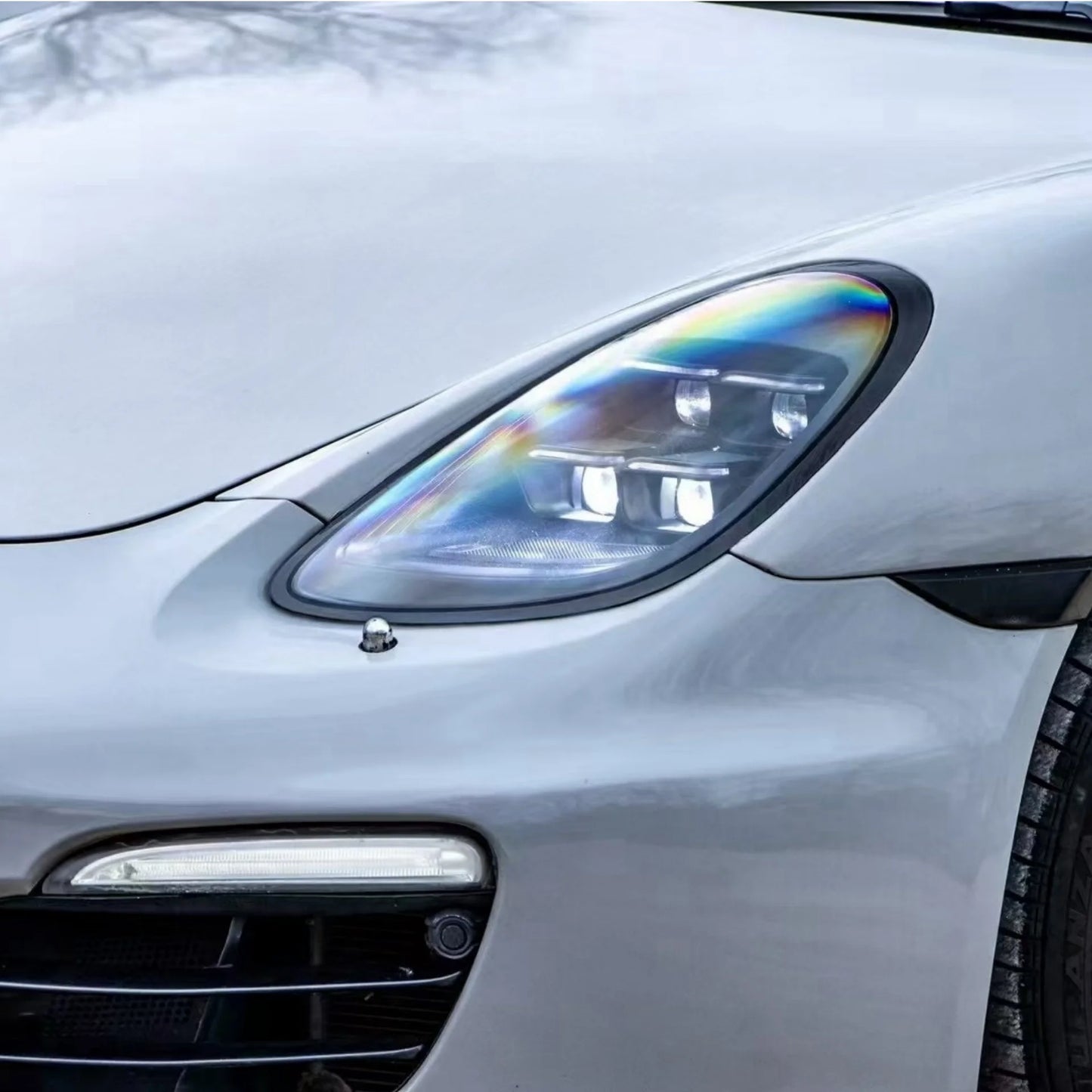 Close-up of a porsche cayman headlight with a Fast Life Custom LED