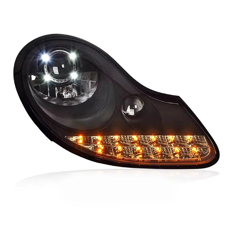 Porsche Boxster 986 headlight with amber turn signal on a white background
